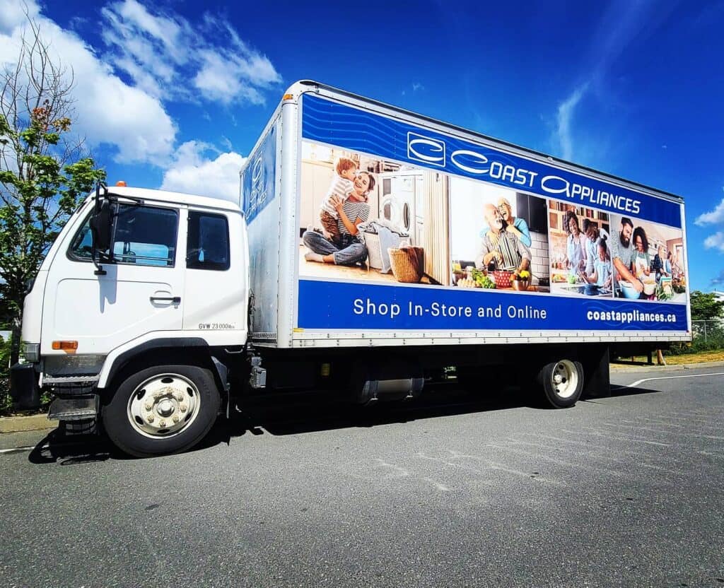 Custom vehicle wrap advertising Coast Appliances with store info and images of appliances.