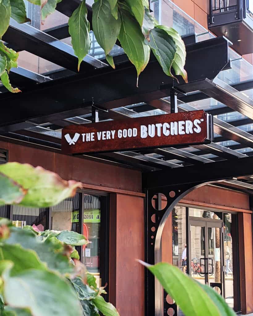 Custom "Fresh Meat" sign for a butcher shop, mounted outside a storefront.