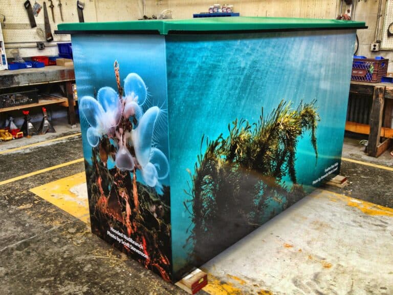 Custom sign pad featuring an underwater marine scene with jellyfish and coral.