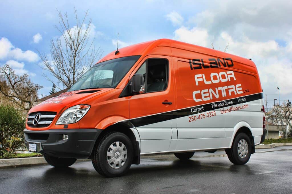 Vehicle wrap for Island Floor Centre promoting flooring services.