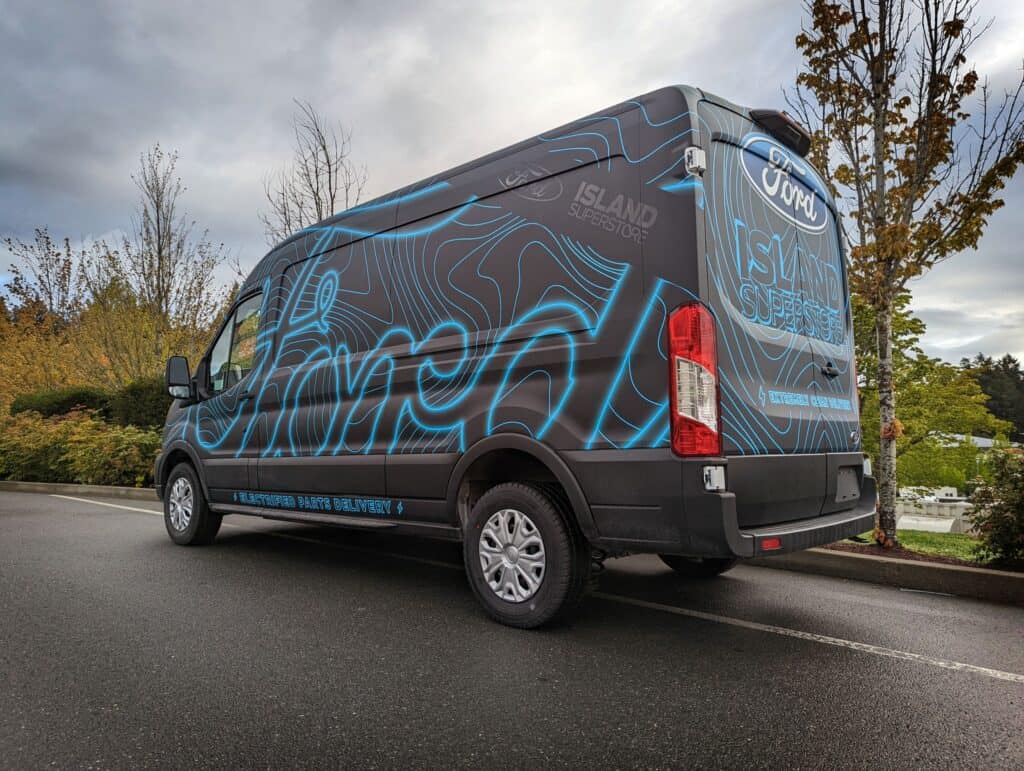 Custom vehicle wrap featuring Island Signs Victoria branding on a Ford van.