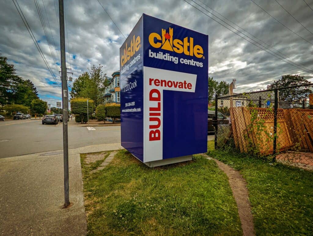 Large outdoor Castle building centres sign with renovation and build advertisements.