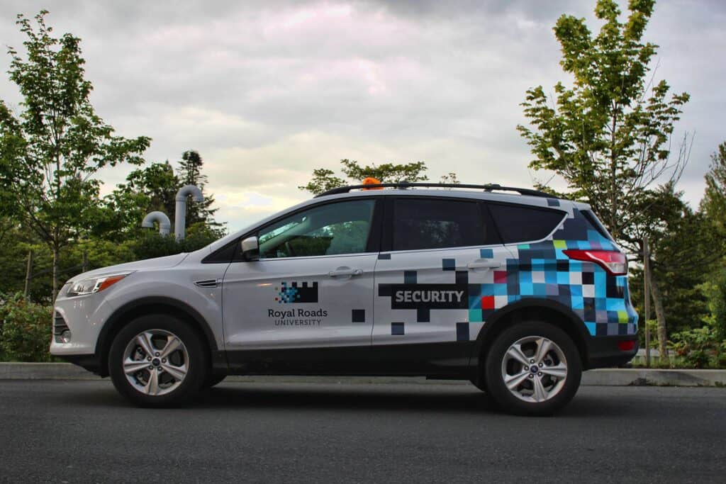 Security vehicle wrap with digital pixel design for Royal Roads University.