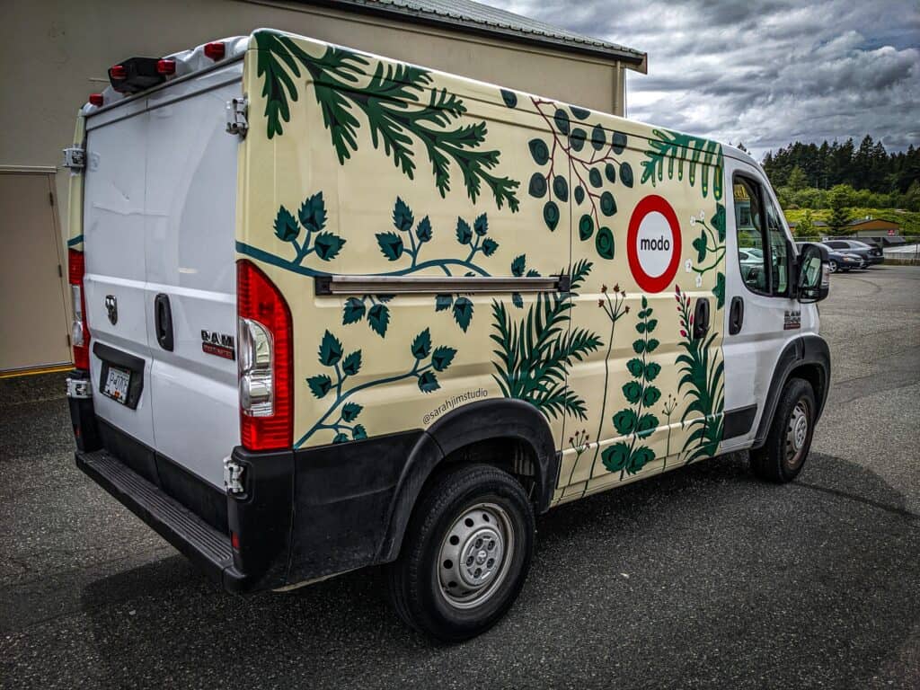 Custom vehicle wrap with green botanical design in Victoria.
