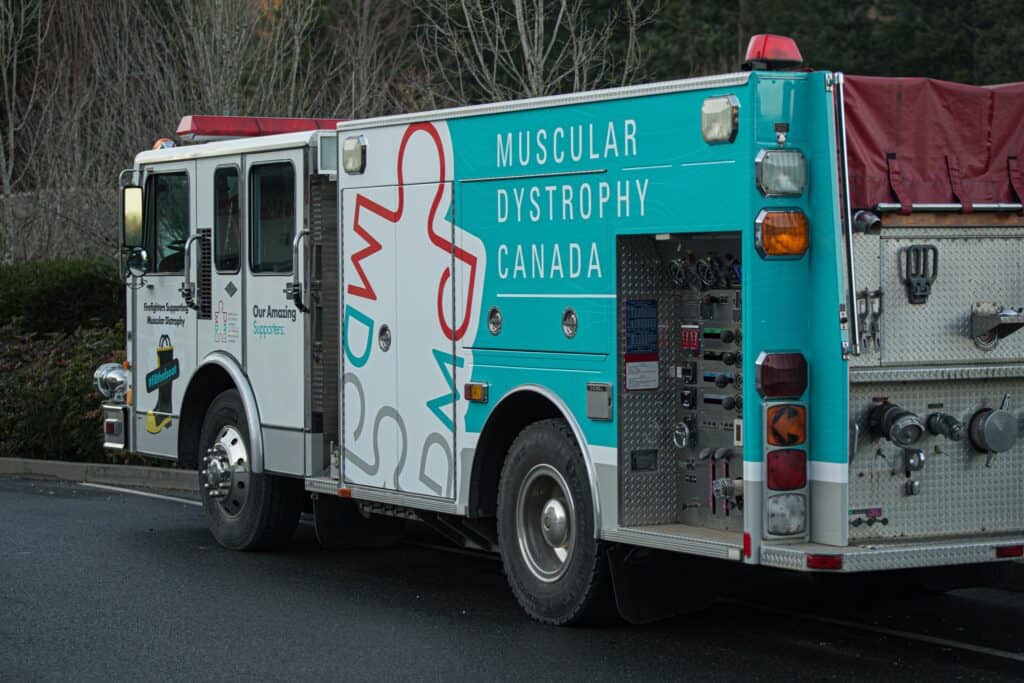 Fire truck with Muscular Dystrophy Canada branding and logo.