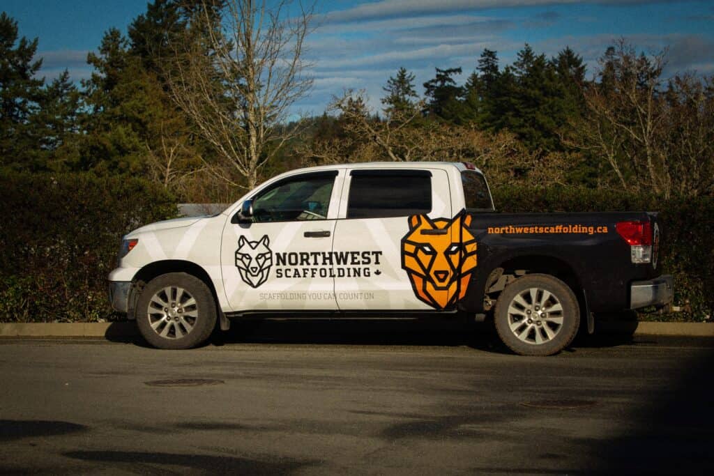 Custom vehicle wrap for Northwest Scaffold with logo and contact info.