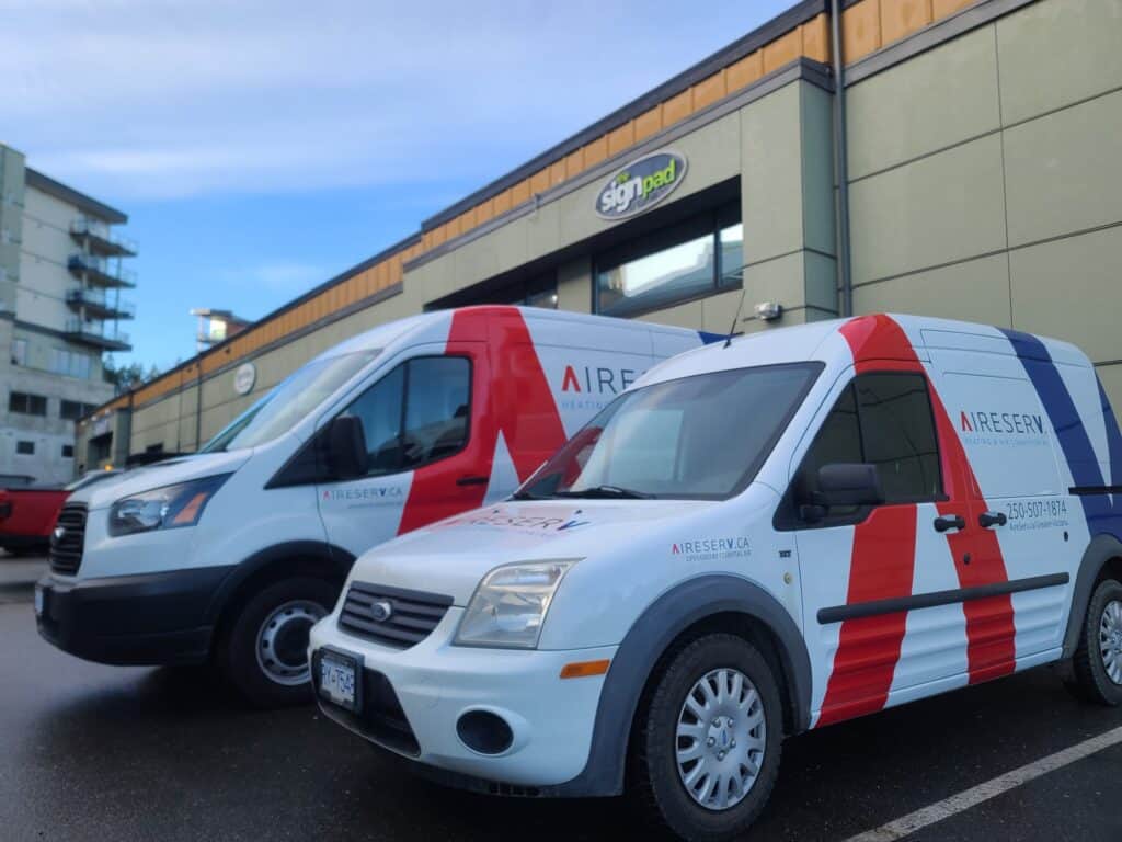 Custom vehicle wraps on vans in Victoria for branding and advertising.
