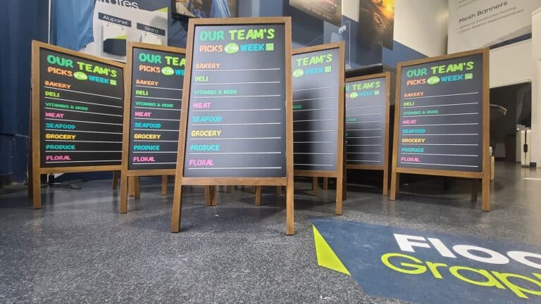 Vibrant outdoor chalkboard signs showcasing weekly specials and team picks in Victoria.