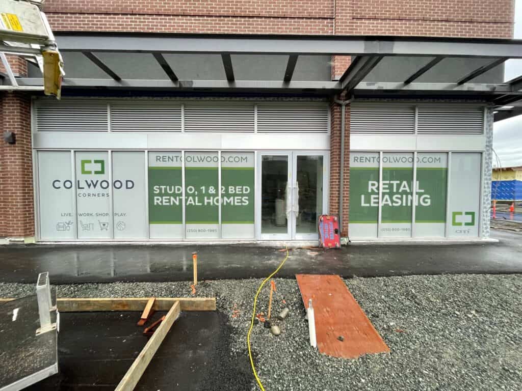 Modern storefront window signage promoting rental and retail leasing services in Victoria.