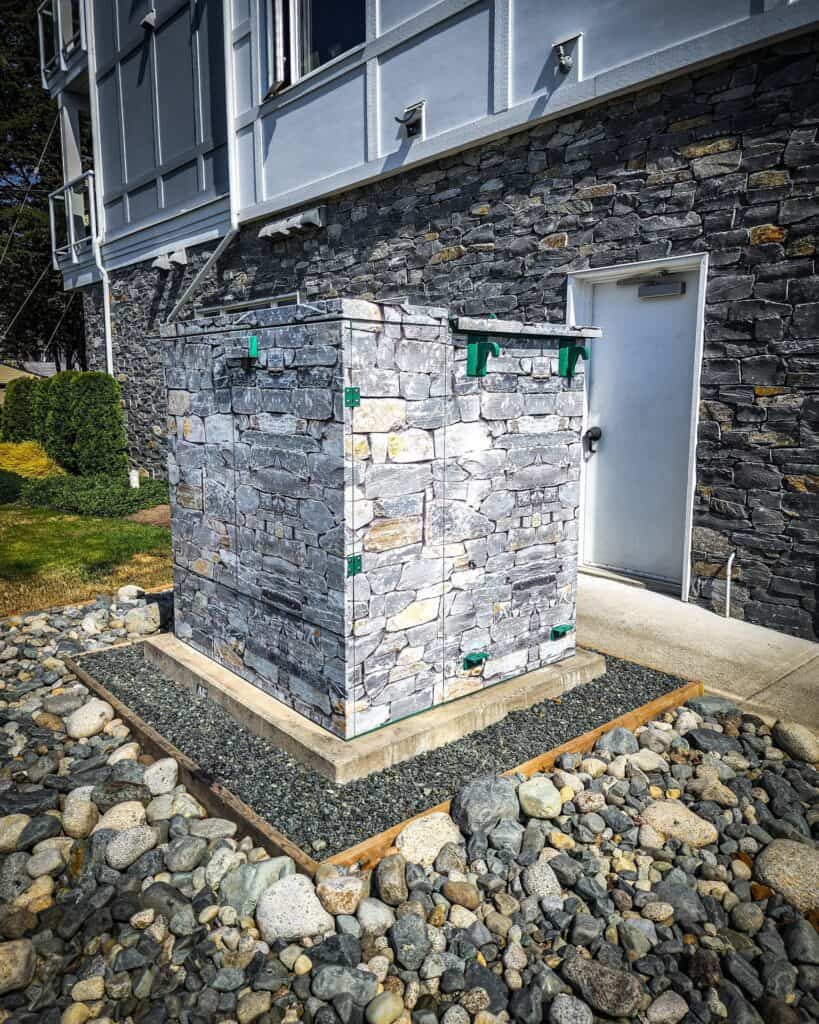 Utility box with stone cladding for a sleek exterior look.