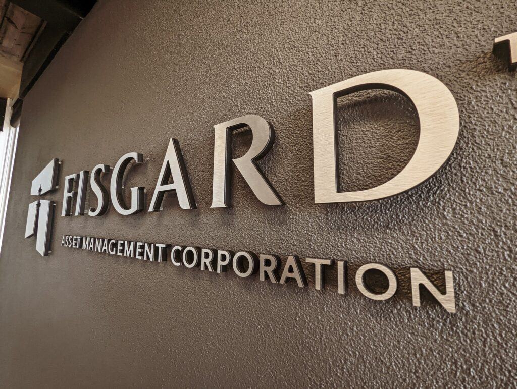 Fidgar Asset Management Corporation sign on textured wall in Victoria.