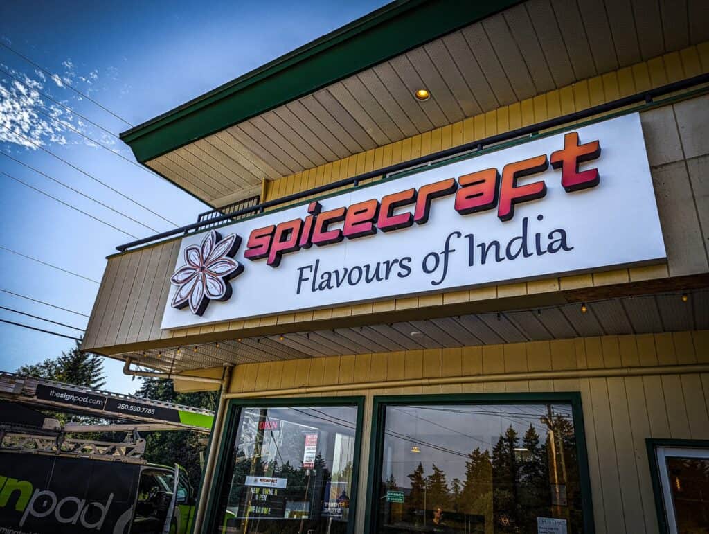 Custom Spicecraft sign on storefront in Victoria, showcasing vibrant branding.