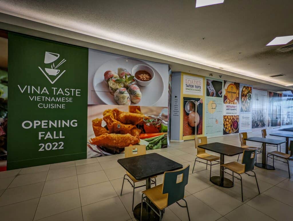 Vina Taste Vietnamese Cuisine sign displayed at the restaurant entrance.