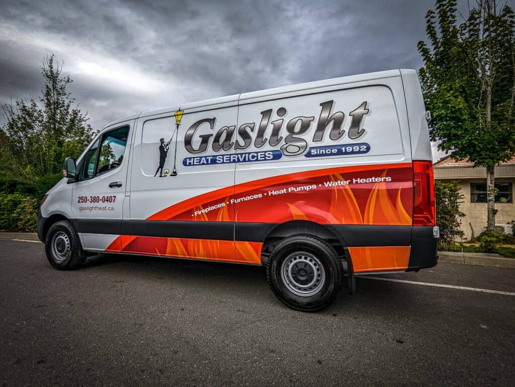 Gaslight vehicle wrap promoting heat services and water heaters.