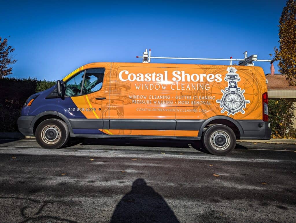 Custom vehicle wrap for Coastal Shores Window Cleaning on a van.