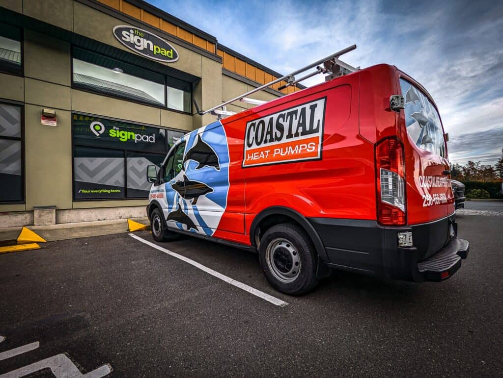 Vehicle wrap featuring Coastal Heat Pumps branding and graphics.