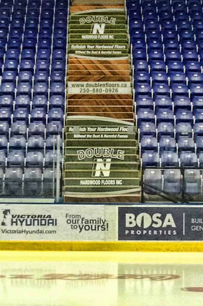 Indoor hardwood flooring sign for Double N Floors at Victoria ice rink.
