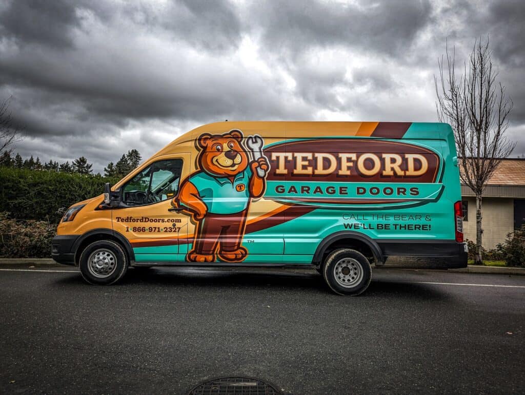 Custom vehicle wrap for Teddord Garage Doors featuring a bear mascot.