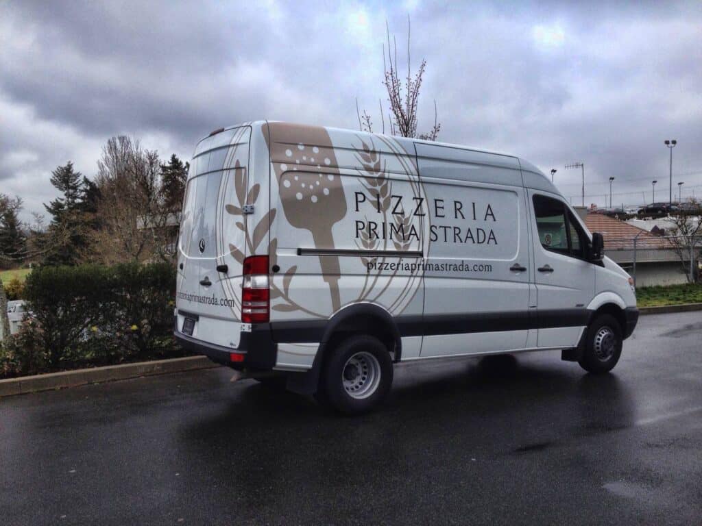 Custom pizzeria van with logo and branding in Victoria.