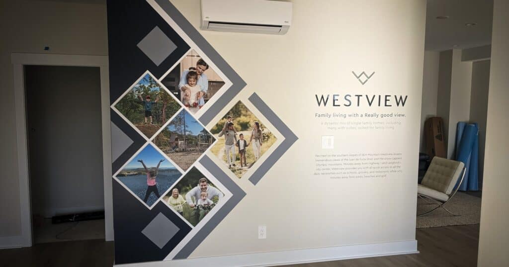 Custom Westview sign wall with geometric design and family photos.