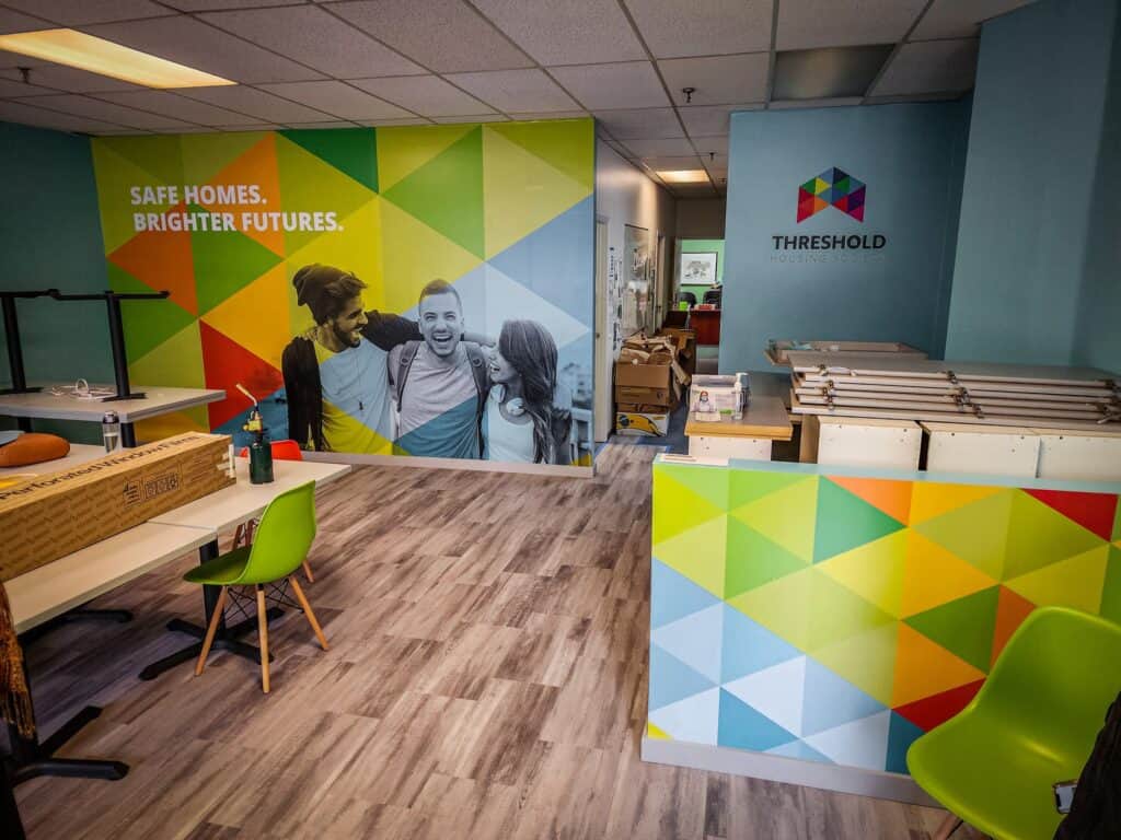 Bright, colorful interior with custom wall graphics and signage.
