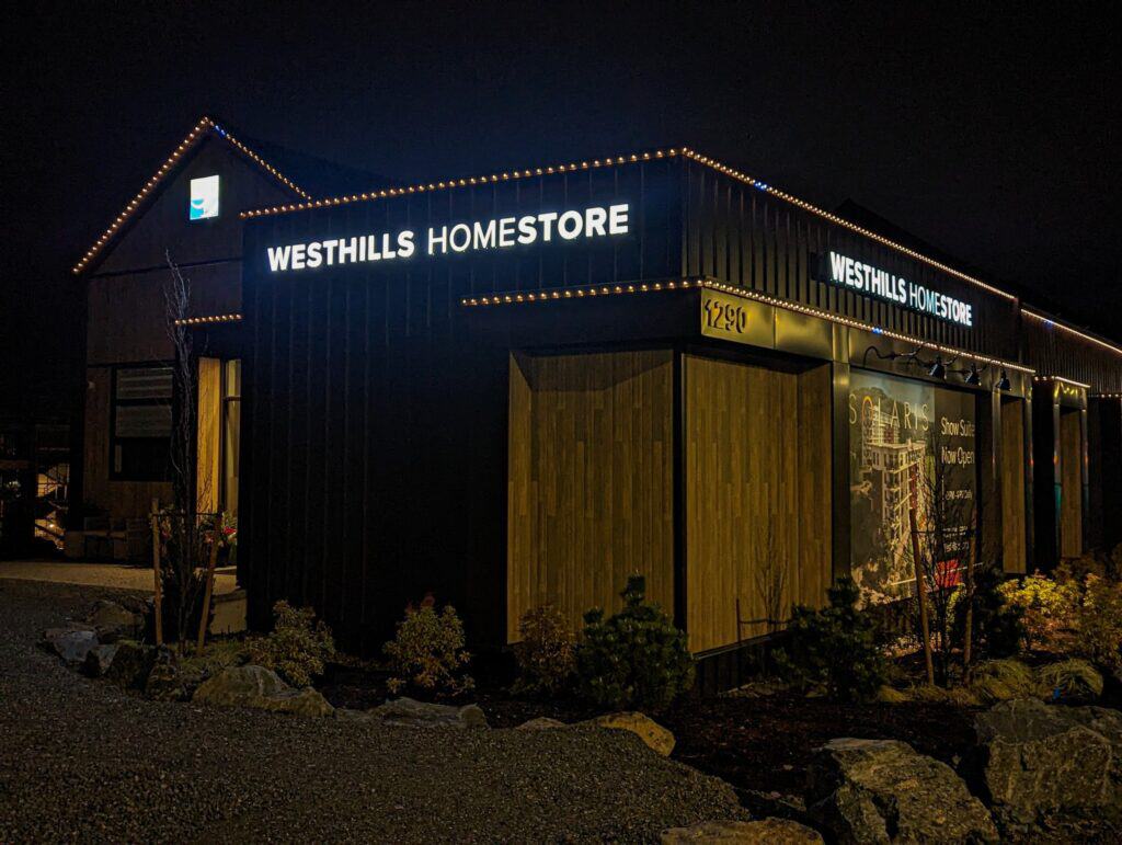 Illuminated night sign for Westhills Homestore in Victoria, showcasing the business name.