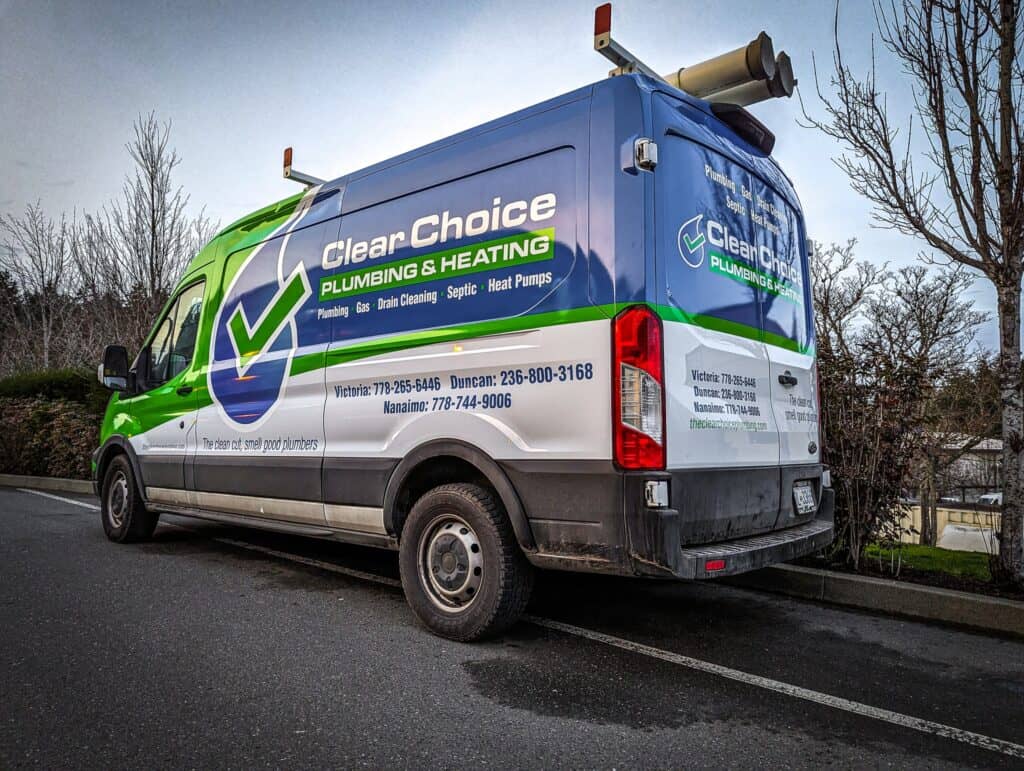 Custom vehicle wrap for plumbing and heating services on a commercial van.