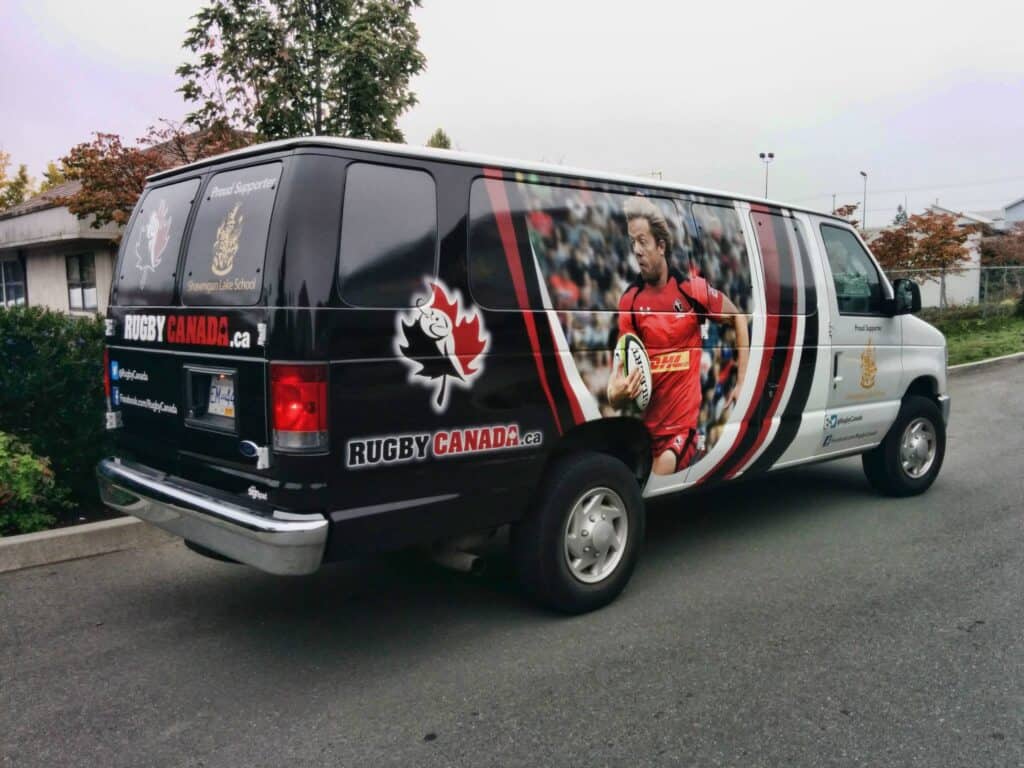 Custom rugby-themed vehicle wrap for Rugby Canada on van.