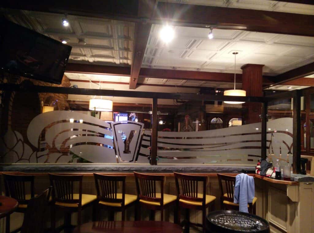 Interior view of a bar with custom signage and vehicle wraps in Victoria.