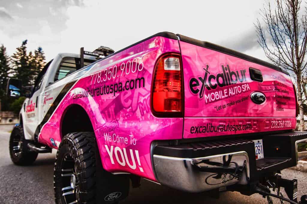 Custom pink vehicle wrap for Excalibur Auto Spa in Victoria.