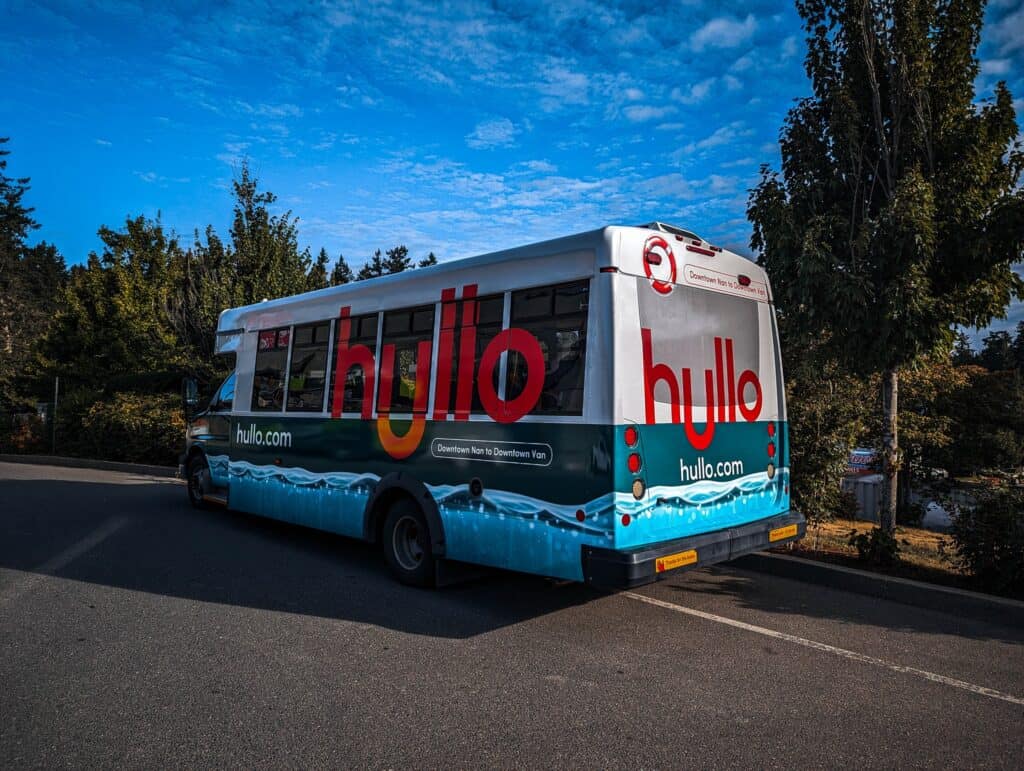 Custom Hulio bus wrap with vibrant branding in Victoria.