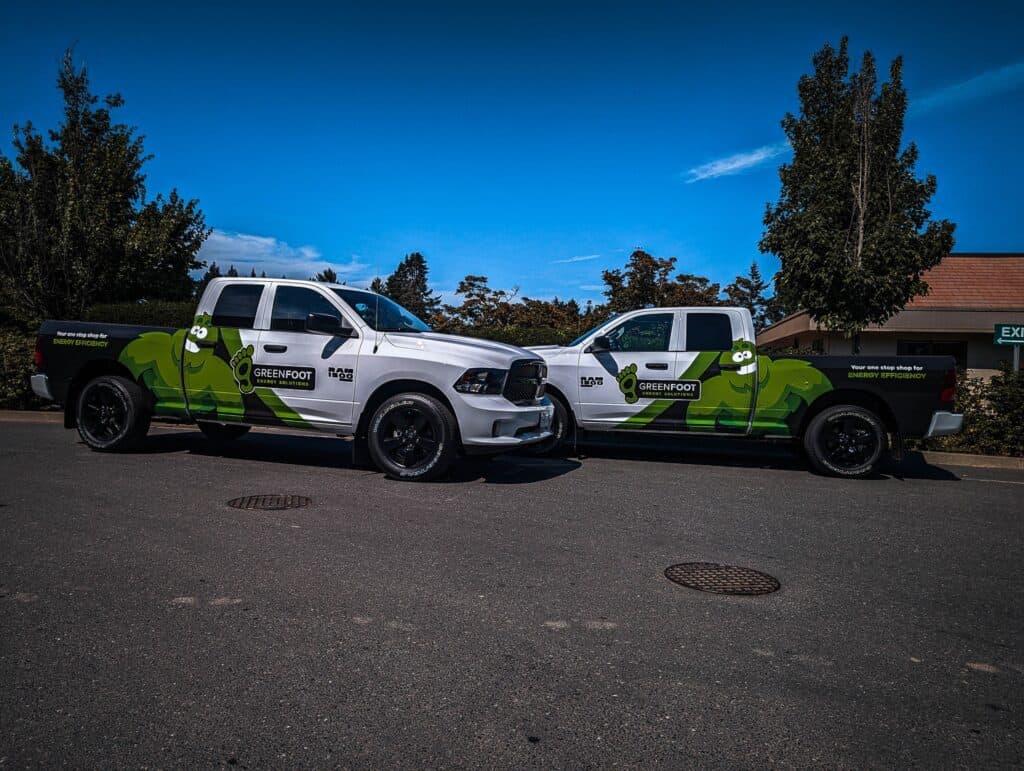 Custom vehicle wraps for Greenfoot, showcasing branding on trucks in Victoria.