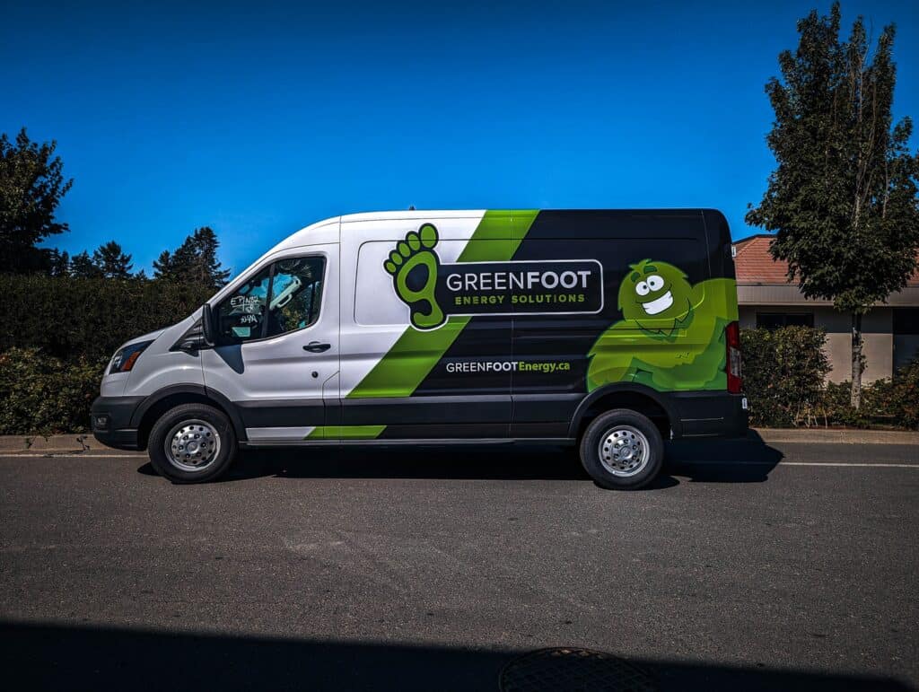 GreenFoot energy solutions vehicle wrap with logo and mascot.