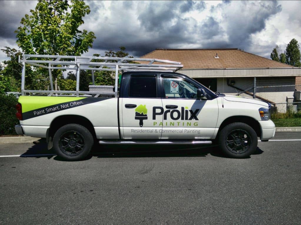 Custom vehicle wrap for Prolix Painting on a white pickup truck.