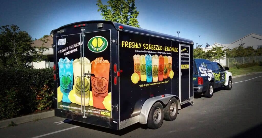 Custom lemonade food truck with colorful drink graphics in Victoria.