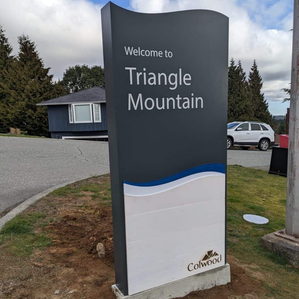 Welcome sign for Triangle Mountain in Victoria, featuring a modern design with space for custom sign.