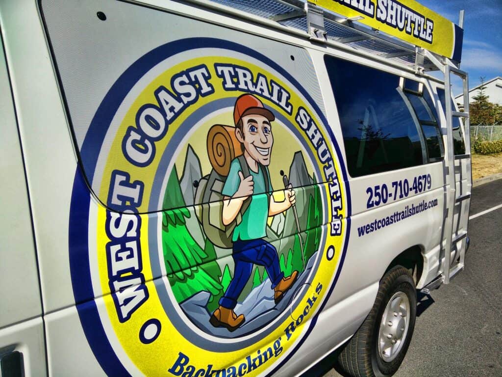 Wedge Coast Trail Shuttle vehicle with custom signage in Victoria.