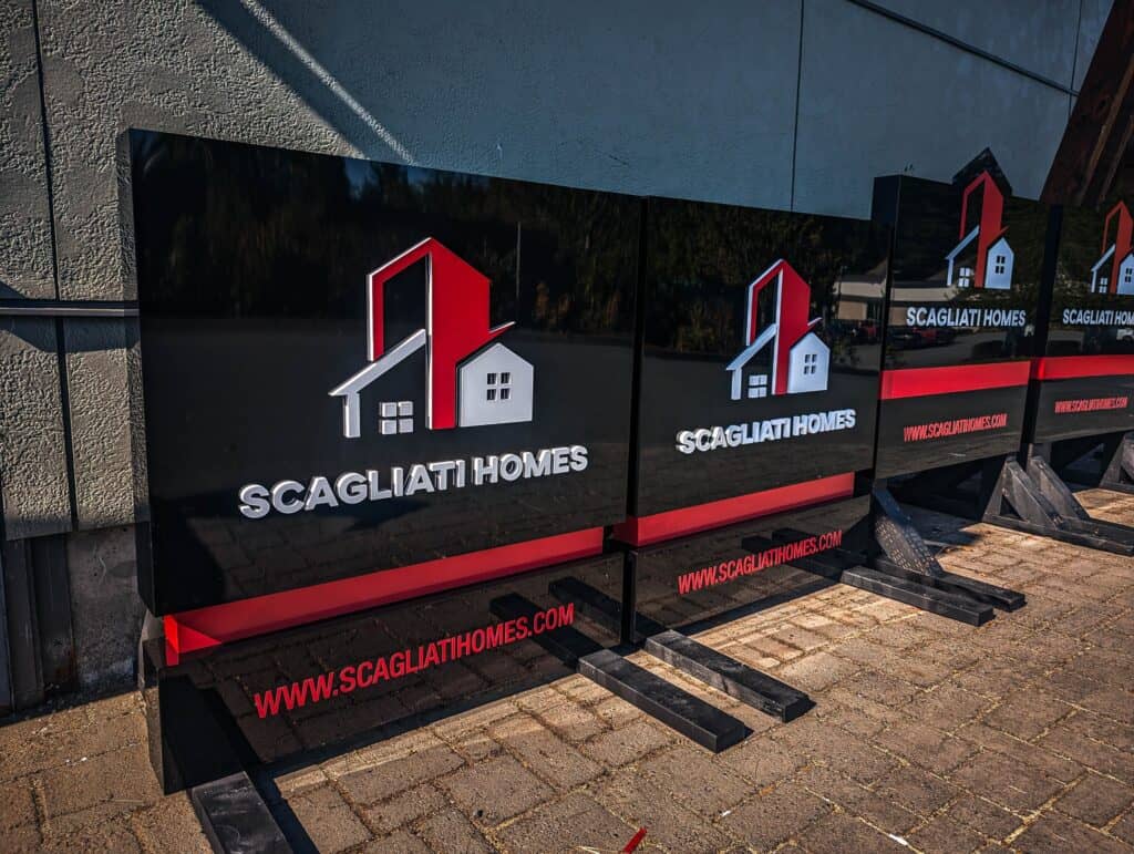 Outdoor custom signs for Scagliati Homes with logo and website.