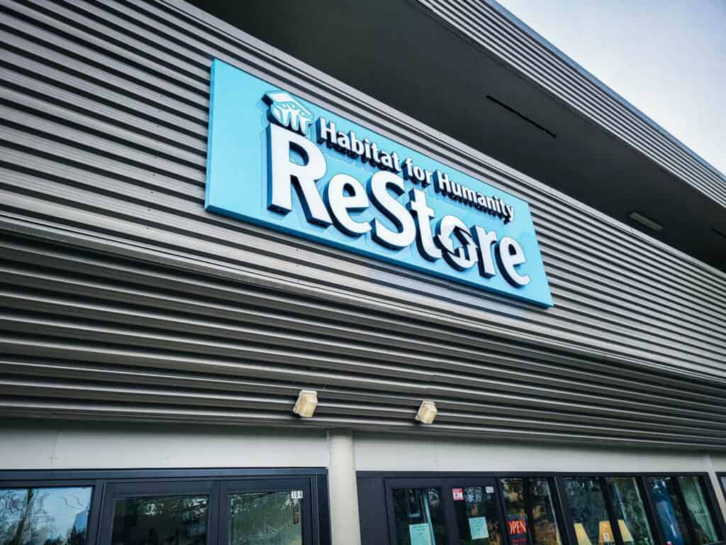 Habitat for Humanity Restore sign on building exterior.