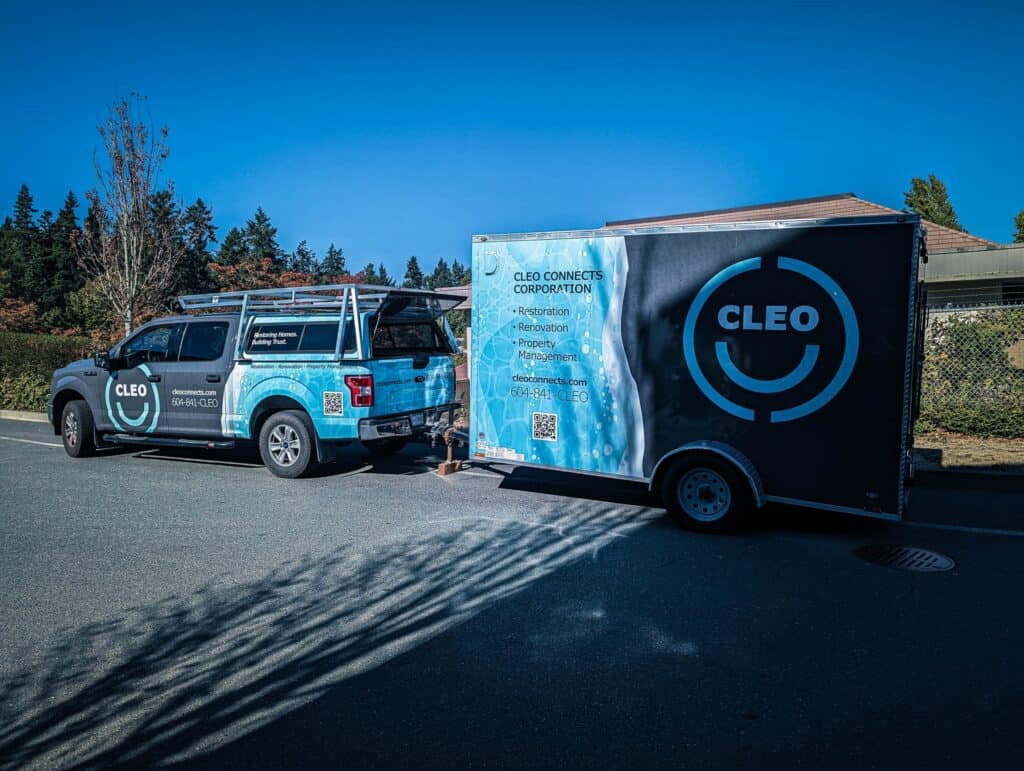 Company vehicle with attached trailer featuring Cleo Connects branding and logo.