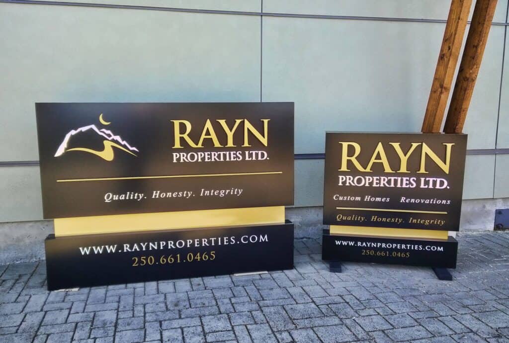 Custom outdoor signs for Rayn Properties Ltd. in Victoria, showcasing branding and contact info.