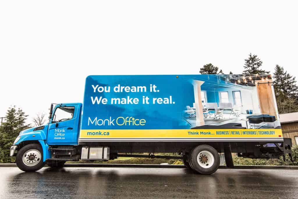Custom vehicle wrap for Monk Office promoting branding and advertising.