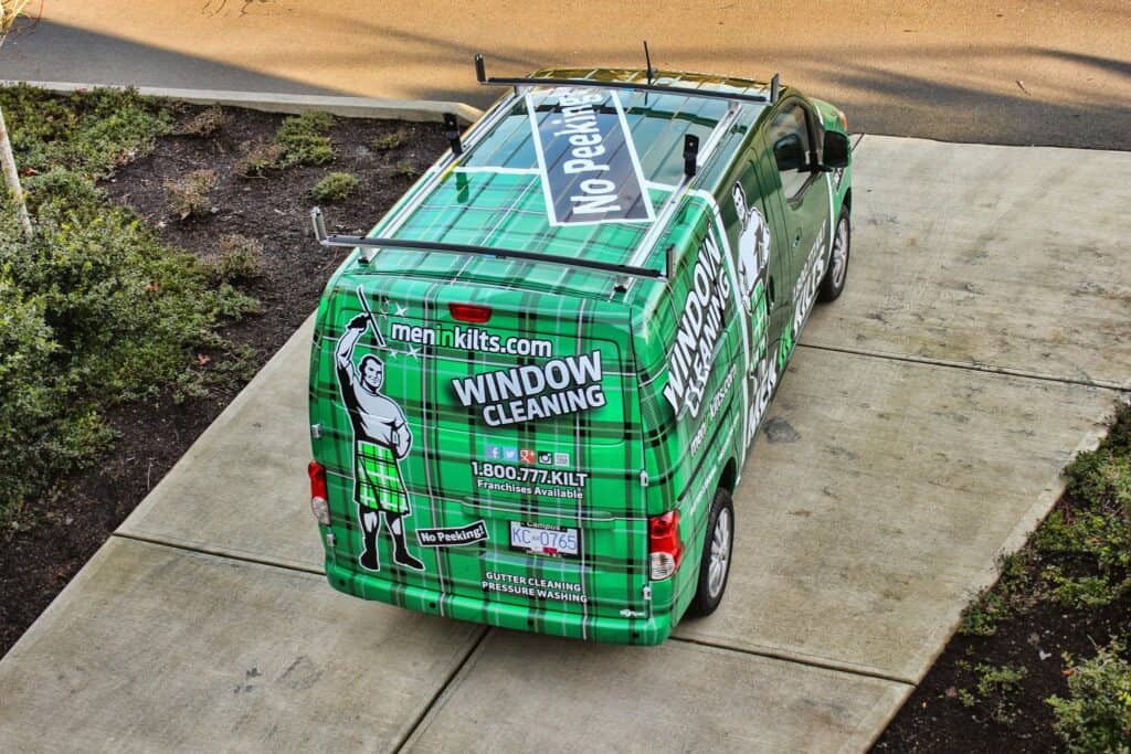 Vehicle wrap promoting window cleaning services in Victoria.