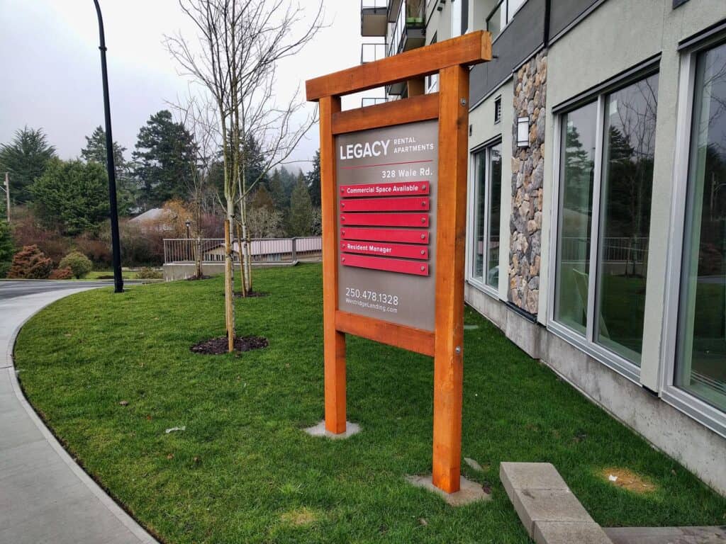 Signage with directory and contact info for Legacy Apartments, Victoria.