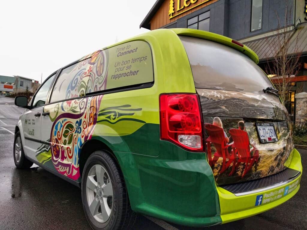 Custom vehicle wrap with colorful design in Victoria, showcasing branding.