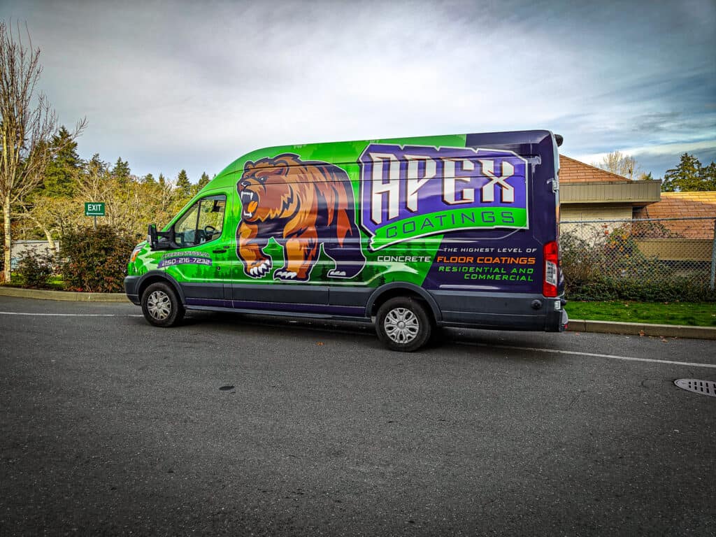 Custom vehicle wrap for Apex Coatings featuring a lion logo and vibrant green and purple design.