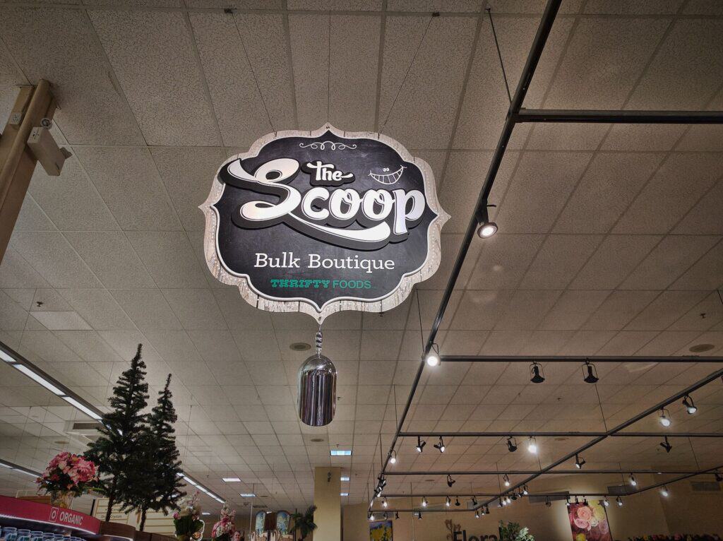 Sign for The Scoop Bulk Boutique and Trippy Foods.