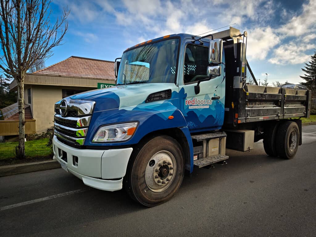Vehicle wrap on a blue and black truck in Victoria.