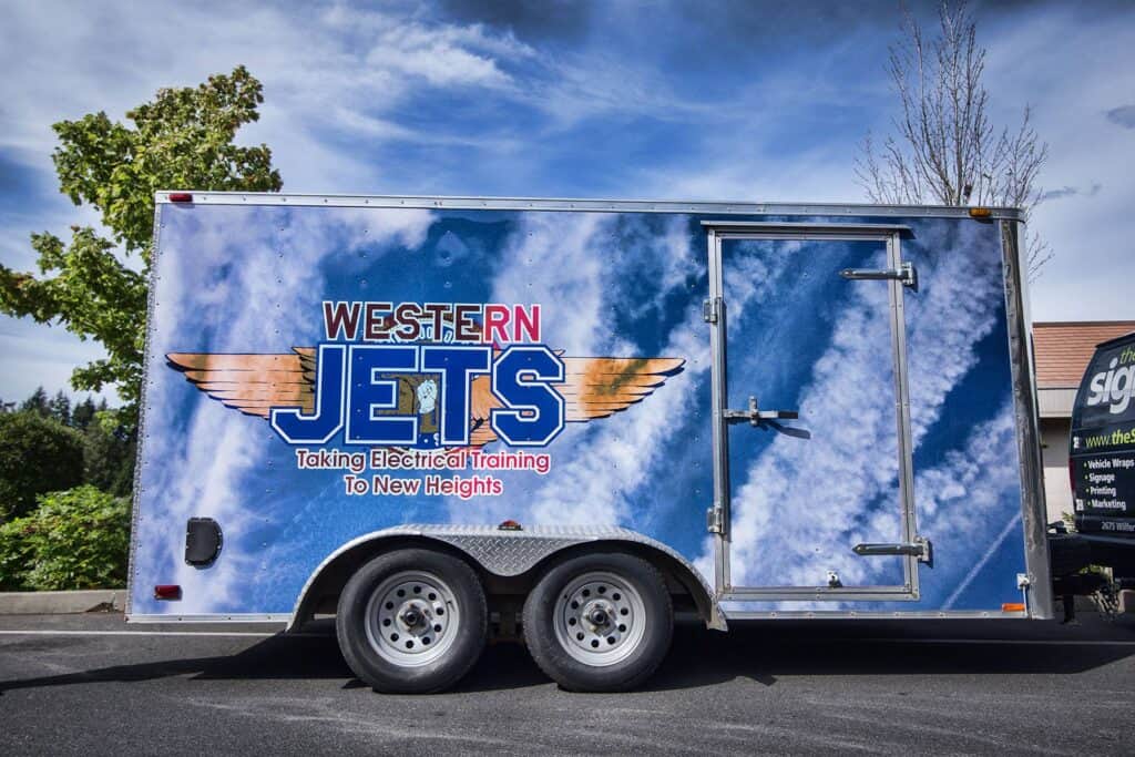 Western Jets trailer with sky-themed custom signage and logo.