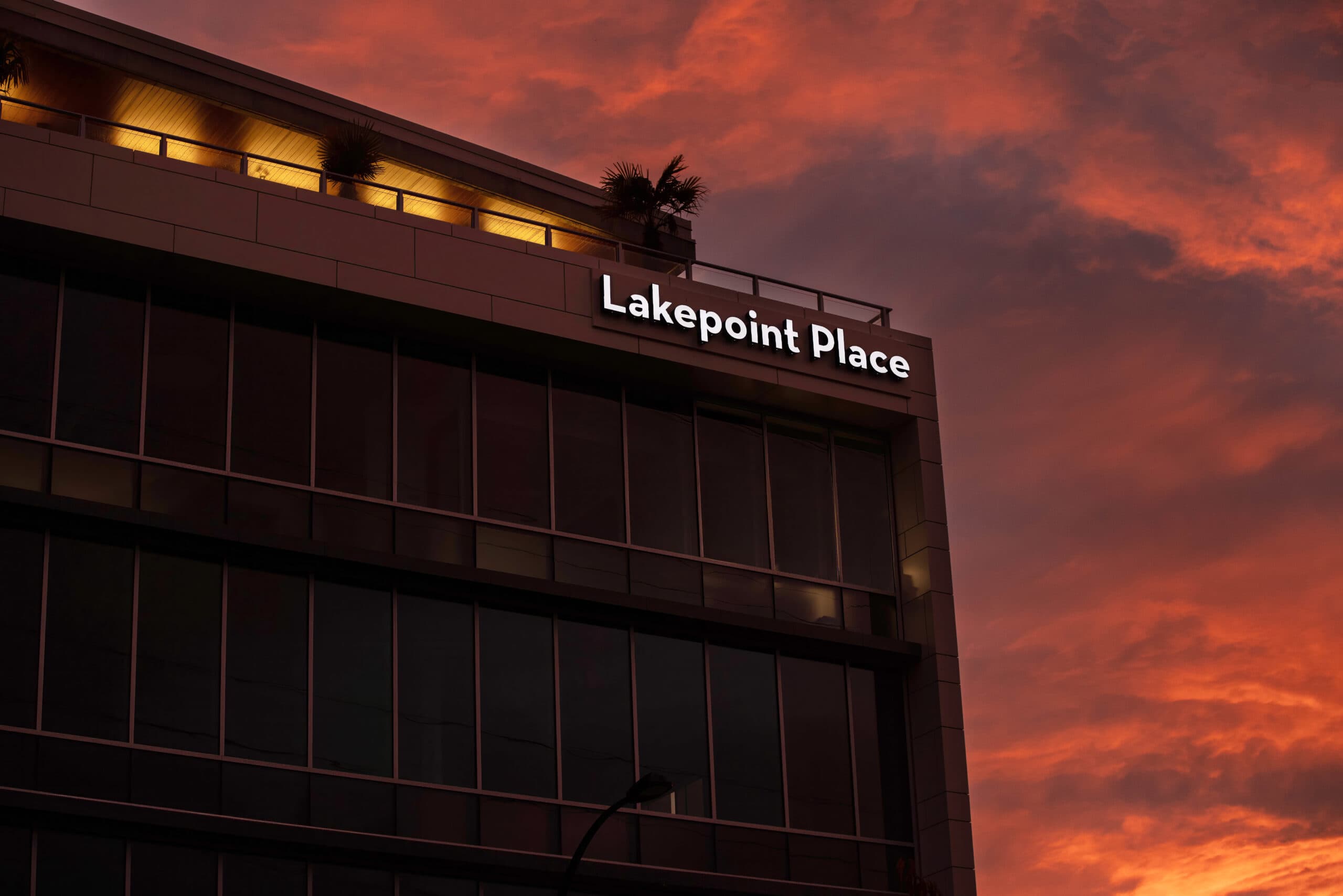 Lakepoint Place rooftop channel letters at sunset